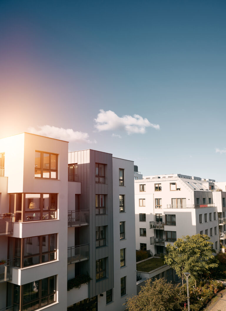 New modern apartment complex. Low-rise European apartment building complex with outdoor facilities.